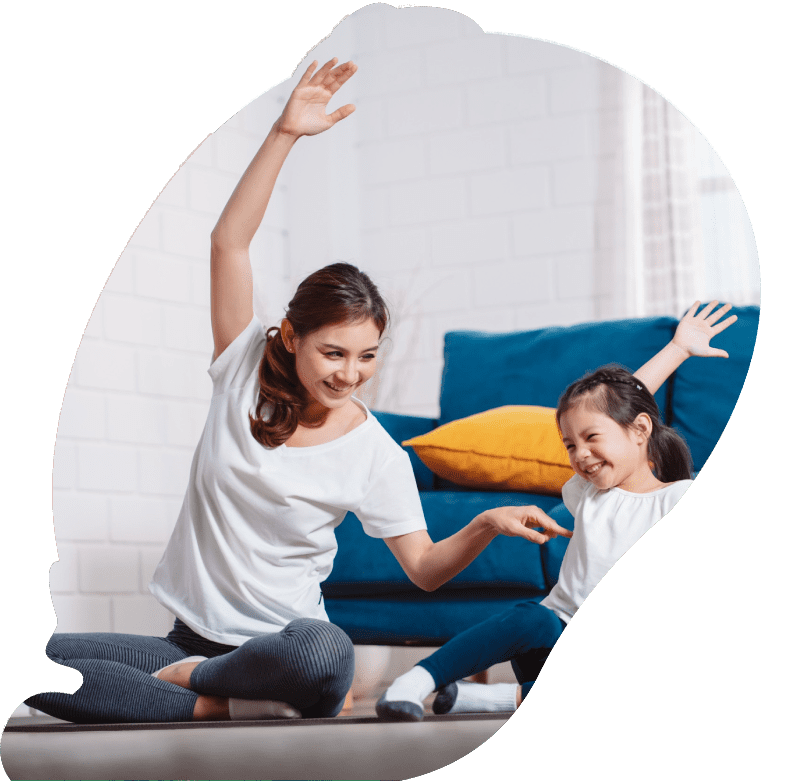 one on one behavior support Mother and daughter exercising together happily at home